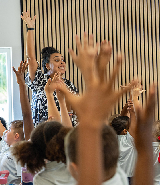 scholarships-and-discounts-classroom-hands-raised